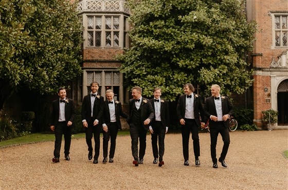 Groomsmen outside the front of Great Fosters