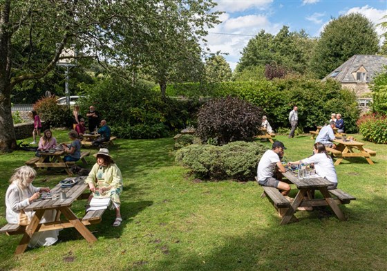 Relax outside to the front of the Bathhurst Arms with the River Churn running through Bathurst Garden