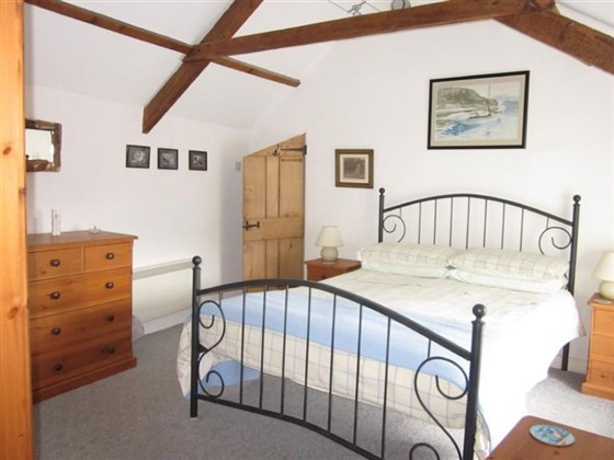 Master bedroom with vaulted ceiling