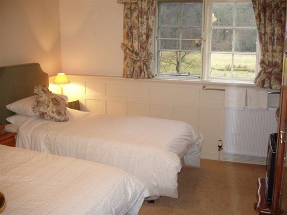 Twin bedded room with shower