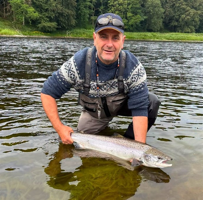 1.Mr Norman Deakin lands a nice fish at Newtyle on Thursday
